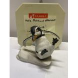 A porcelain figure of a penguin Whoops by Franklin mint