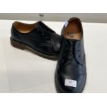 A pair of Dr Marten shoes size 11