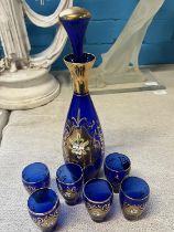 A Bohemian blue glass decanter and six small glasses