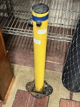A folding parking post with key, shipping unavailable