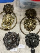 A selection of antique lion themed metal wares including door knocker & toilet roll holders