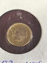 A 1858 American $1 gold coin
