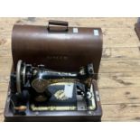A vintage manual Singer sewing machine. Shipping unavailable