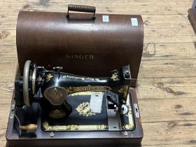 A vintage manual Singer sewing machine. Shipping unavailable