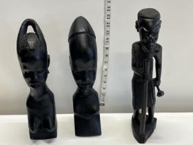 Three assorted carved African figurines tallest 38cm