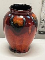 A collectable Poole pottery small vase h11cm