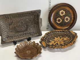 Four assorted hand carved wooden bowls