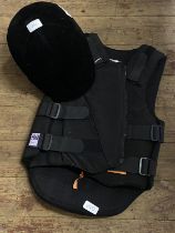 A horse riding safety helmet and body armour