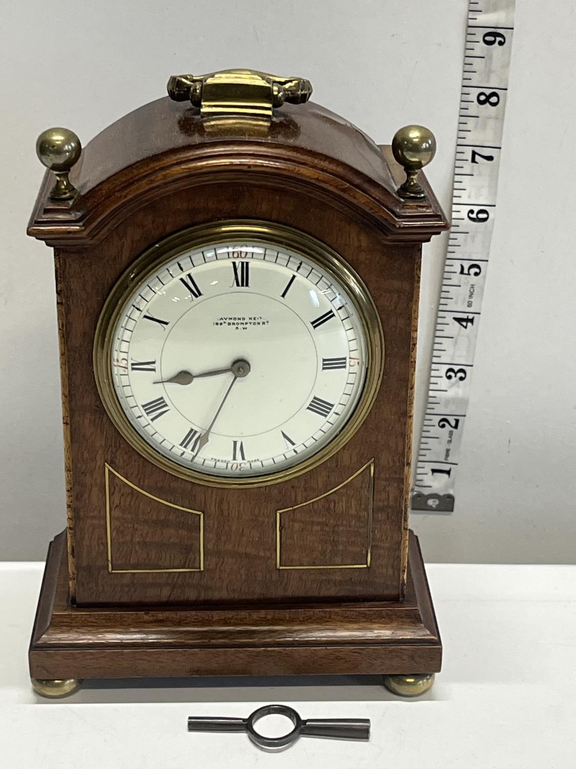 A vintage mahogany cased mantle clock with key, French manufactuer
