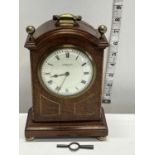 A vintage mahogany cased mantle clock with key, French manufactuer