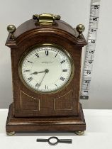 A vintage mahogany cased mantle clock with key, French manufactuer