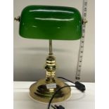 A bankers style brass and green glass desk lamp