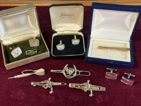 A selection of assorted costume jewellery cufflinks and tie-clips including Selfridges and Masonic
