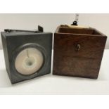 A wooden cased vintage pigeon clock called 'Invincible Timer' by Fattorini and Sons