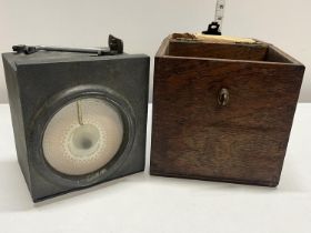 A wooden cased vintage pigeon clock called 'Invincible Timer' by Fattorini and Sons