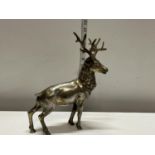 A hollow cast bronze stag with overlaid silver decoration