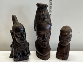 Three assorted carved African figurines tallest 33cm