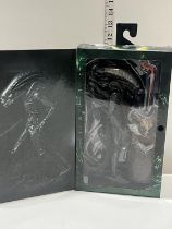 A boxed Neca Alien figure