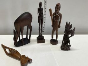 Five carved African figurines tallest 31cm