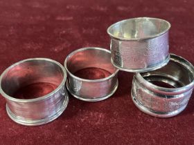 Four assorted hallmarked silver napkin rings 64g