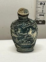 A cinnabar carved Chinese snuff bottle
