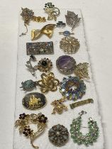 A selection of assorted costume jewellery brooches