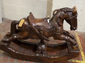 A large antique Chinese rosewood rocking horse. 94cm tall x 130cm long. shipping unavailable