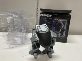 A boxed Neca Robo Cop ED-209 figure