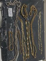 A job lot of gold plated and base metal necklaces and bracelets