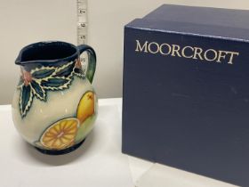 A boxed limited edition Moorcroft jug 10/20 entitled 'Festive Fruit' by A Davenport h15cm