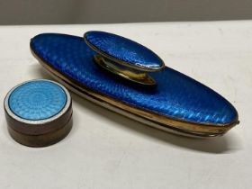 A ladies blue guilloche and gilt nail buffer and a blue enamel and gilt guilloche pill box