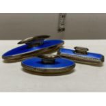 Three hallmarked silver and blue enamel guilloche nail buffers