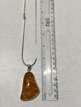 A 925 silver chain and Amber style pendant
