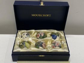 A boxed limited edition Moorcroft set of six 2003 Easter Egg cups