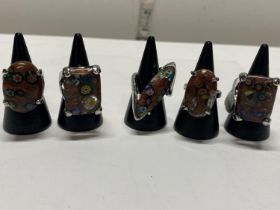Five assorted millefiori style dress rings