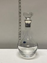 A quality crystal decanter with large silver hallmarked collar