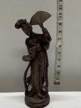 A Chinese soap stone figure of a lady holding a fan