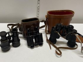 Three assorted pairs of vintage binoculars a/f