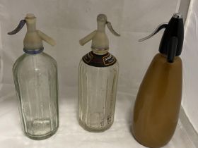 A selection of soda syphon bottles and a Sparkles soda syphon