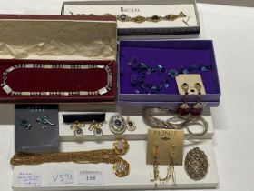 A shelf of assorted costume jewellery including Monet, Sarah Cov.gv