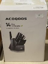 A boxed ACOQOOS knife set (unchecked)