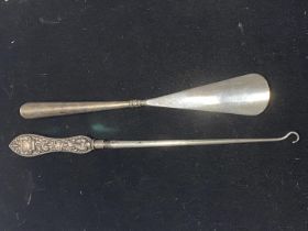 A Victorian hallmarked silver handled shoe horn and button hook