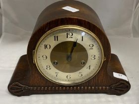 A vintage 1930's mahogany cased mantle clock with key and pendulum, shipping unavailable