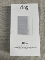 A boxed and sealed Ring plug in door chime (untested)