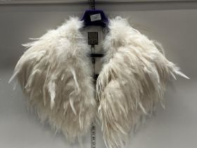 A ladies feather style shoulder jacket by Biba with tags