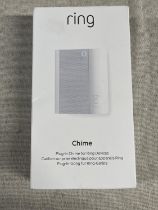 A boxed and sealed Ring plug in door chime (untested)