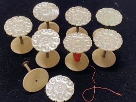 A selection of 19th century mother of pearl cotton reel bobbins