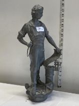 A unusual metal figurine of a leather worker h44cm