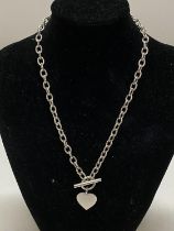 A hallmarked silver T bar chain with pendant 30.56g