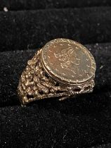 A 1853 American gold dollar in a 9ct gold mount 4.57g total weight, size m1/2 (possibly resized)